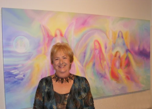 Glenyss with her painting Co Creation at Sanctuary Angel Gallery in Australia